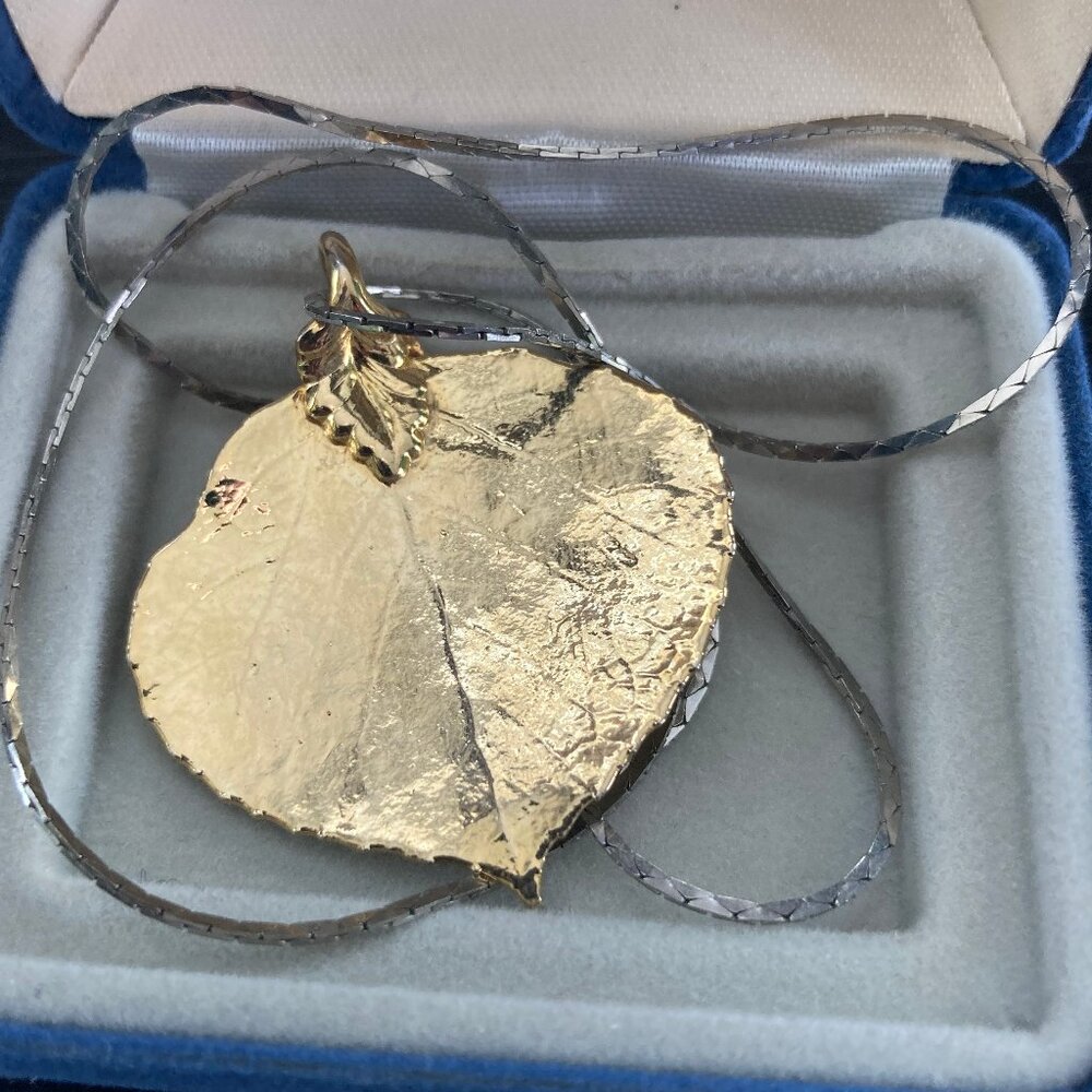 Gold leaf necklace on a silver chain, 20 in.